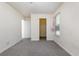 Simple bedroom with grey carpet and window with blinds at 255 Sea Turtle Dr., Myrtle Beach, SC 29588