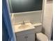 Bathroom with modern sink, toilet, and white wood paneling at 2708 Main St., Loris, SC 29569