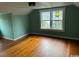 Bedroom with hardwood floors and mint green walls at 2708 Main St., Loris, SC 29569