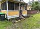 This home has a screened porch, a wood deck, and two raised garden beds full of flowers at 2708 Main St., Loris, SC 29569