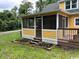 This home has a screened porch, a wood deck, and two raised garden beds full of flowers at 2708 Main St., Loris, SC 29569