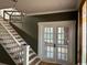 Entryway features a staircase and decorative glass doors into another room at 2708 Main St., Loris, SC 29569