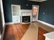 Inviting living room with hardwood floors, fireplace, and built-in shelving at 2708 Main St., Loris, SC 29569