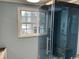 Modern bathroom with a glass enclosed shower and window view at 2708 Main St., Loris, SC 29569