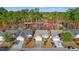 Aerial view of a well-maintained home showcasing a driveway and lush foliage at 352 Mckendree Ln., Myrtle Beach, SC 29579