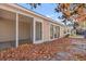 Inviting outdoor space featuring a screened-in porch, patio, and colorful autumn foliage at 352 Mckendree Ln., Myrtle Beach, SC 29579