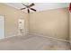 Large bedroom featuring a ceiling fan and an en-suite bathroom at 352 Mckendree Ln., Myrtle Beach, SC 29579