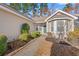 Inviting single-story home featuring manicured landscaping and a welcoming front entrance at 352 Mckendree Ln., Myrtle Beach, SC 29579