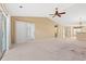 Bright, open living room has a ceiling fan and sliding glass door to yard at 352 Mckendree Ln., Myrtle Beach, SC 29579