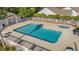 Aerial view of a community pool with hot tub, white fence, palm trees, and lush greenery at 352 Mckendree Ln., Myrtle Beach, SC 29579