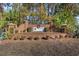 Community sign and landscaping with red brick base and pine tree backdrop at 352 Mckendree Ln., Myrtle Beach, SC 29579