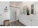 Modern bathroom with a glass-enclosed shower, dual vanities, and stylish fixtures at 556 Duvall St., Longs, SC 29568
