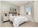 Comfortable bedroom featuring neutral decor, a cozy bed, and stylish lighting at 556 Duvall St., Longs, SC 29568