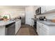 Modern kitchen featuring stainless steel appliances, granite countertops, and ample cabinet space at 556 Duvall St., Longs, SC 29568