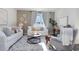 Cozy living room with plush sofas, decorative accents, and bright natural light at 556 Duvall St., Longs, SC 29568