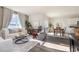 Bright living room with comfortable seating, stylish decor, and large windows at 556 Duvall St., Longs, SC 29568