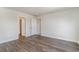 Spacious bedroom with wood-look flooring, ample natural light, and neutral paint at 7047 Shooting Star Way, Myrtle Beach, SC 29579