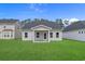Backyard with healthy grass, an outdoor patio, and an in-ground irrigation system at 1200 Nw Calabash Station Blvd., Calabash, NC 28467