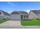 Charming single-story home featuring a two-car garage, well-manicured lawn, and lovely curb appeal at 1200 Nw Calabash Station Blvd., Calabash, NC 28467