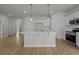 Stylish kitchen with white cabinets, stainless steel appliances, and a functional center island for meal prep at 1200 Nw Calabash Station Blvd., Calabash, NC 28467