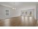 Spacious and bright living area features modern light fixtures, wood-look floors, and backyard access at 1200 Nw Calabash Station Blvd., Calabash, NC 28467