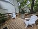 The outdoor back deck area includes white plastic chairs at 306 E Godbold St., Marion, SC 29571