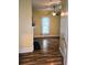 Bedroom with wood floors, bright window, ceiling fan and decorative fireplace at 306 E Godbold St., Marion, SC 29571