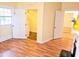 Bedroom with a bathroom ensuite, neutral colors, and hardwood floors at 306 E Godbold St., Marion, SC 29571