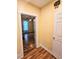View from hall into a bedroom with wood floors, bright window and ceiling fan at 306 E Godbold St., Marion, SC 29571
