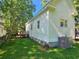 An exterior view shows the side of the house, backyard, and an AC unit at 306 E Godbold St., Marion, SC 29571