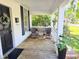 Cozy front porch with seating, offering a comfortable space to unwind and enjoy the neighborhood at 306 E Godbold St., Marion, SC 29571