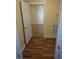 Hallway with laminate flooring leading to another room at 306 E Godbold St., Marion, SC 29571