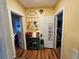 Hallway features hardwood flooring with views into other rooms at 306 E Godbold St., Marion, SC 29571