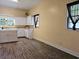 Spacious kitchen with white cabinets, lots of countertop space, and wood-look flooring at 306 E Godbold St., Marion, SC 29571