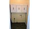 Small laundry room featuring overhead cabinets and wood-look flooring at 306 E Godbold St., Marion, SC 29571