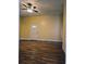 Large living room with wood-look floors and a ceiling fan at 306 E Godbold St., Marion, SC 29571