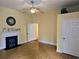 Spacious living room featuring a decorative fireplace, wood floors, and ceiling fan at 306 E Godbold St., Marion, SC 29571