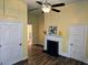 Bright living room with hardwood floors, fireplace, and modern ceiling fan at 306 E Godbold St., Marion, SC 29571