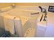 Close-up of accessible walk-in tub featuring grab bars and shower head at 306 E Godbold St., Marion, SC 29571