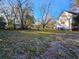 Large backyard with leaves and trees at 306 East Godbold St., Marion, SC 29571