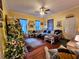 Spacious living room with hardwood floors, comfortable seating, and a Christmas tree at 306 East Godbold St., Marion, SC 29571