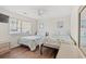 Bright bedroom featuring two twin beds, ceiling fan, and light walls at 5900 N Ocean Blvd., North Myrtle Beach, SC 29582