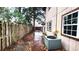 View of the backyard with a brick walkway, wooden fence and AC unit at 618 35Th Ave. N # C, Myrtle Beach, SC 29577