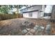 A backyard with a fire pit, a wooden fence and a partially tiled patio at 618 35Th Ave. N # C, Myrtle Beach, SC 29577