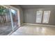 Living room with tile flooring, sliding glass doors and natural light at 618 35Th Ave. N # C, Myrtle Beach, SC 29577