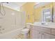 Bathroom featuring a shower/tub combo, neutral vanity, mirror, and tile floors at 8830 Chandler Dr. # E, Myrtle Beach, SC 29575