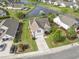 Aerial view of a beautifully landscaped home and serene pond with fountain at 1133 Spalding Ct., Surfside Beach, SC 29575
