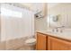 Bathroom with a single sink vanity, neutral color scheme, and shower with tub combo at 1133 Spalding Ct., Surfside Beach, SC 29575