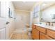Bathroom featuring a single sink vanity, a shower with a built-in seat, and tile flooring at 1133 Spalding Ct., Surfside Beach, SC 29575