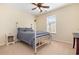 Bedroom with carpet, ceiling fan, a gray bed set, and a window with natural light at 1133 Spalding Ct., Surfside Beach, SC 29575